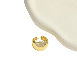 Minimalist gold-plated curved ear cuff with embedded crystals on textured display
