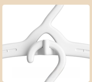 Detail of interlocking connector hooks on white space-saving telescopic baby hangers