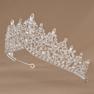 Macro side view of crystal bridal crown with teardrop rhinestones on silver base