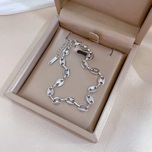 Detailed view of silver stainless steel pig nose chain bracelet with adjustable lobster clasp