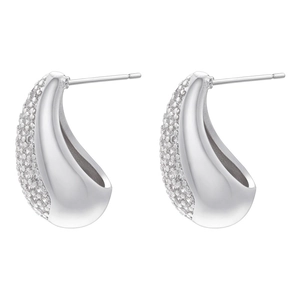 Macro shot of silver teardrop studs with pavé white zircons and mirror-polished inner surface