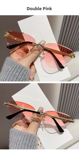 Detail of rimless cat-eye sunglasses with pink gradient lenses and leopard metal accents