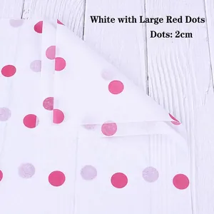 Close-up of white wrapping tissue paper with 2cm red polka dots for flower bouquets