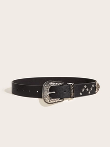 Detail of vintage western black leather belt with silver star studs and floral buckle