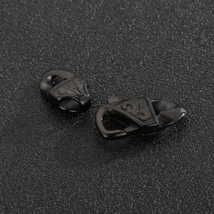 Macro detail of retro engraved gun-black lobster clasps for jewelry necklaces