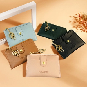 Detail of colorful PU leather coin purses with zipper, snap pocket and metal keychain