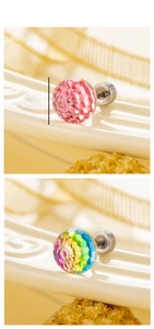 Macro detail of 8mm faceted crystal screw back earrings in pink and rainbow laser colors