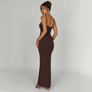 Detail view of a slim fit backless brown maxi dress with thin straps and a floor-length cut