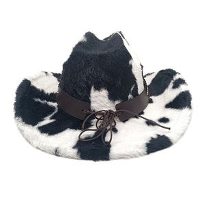 Close-up of cow print plush western cowboy hat with brown faux leather band detail