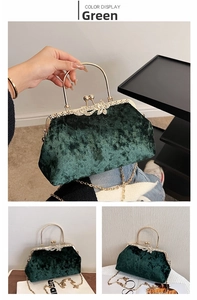 Detail of emerald green velvet shell bag with gold metal handle and bow clasp