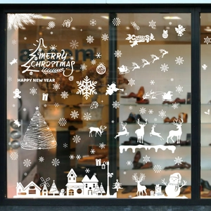 White Christmas window decals featuring snowman, reindeer and Merry Christmas text decor