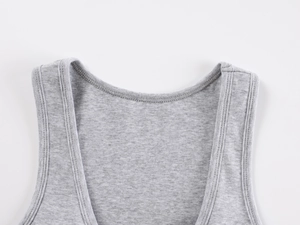 Macro detail of the neckline and double stitching on grey knitted sports tank top