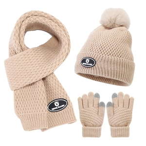 Detailed set of beige winter knit hat with pompom, scarf and touchscreen gloves