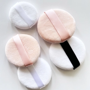 Set of ultra-soft crystal velvet round powder puffs in pink, white, and black with ribbon
