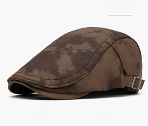 Detail view of coffee brown vintage flat cap with metal buckle and premium stitching