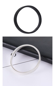 Close-up detail of black and silver metal spring sleeve garters for shirt armbands