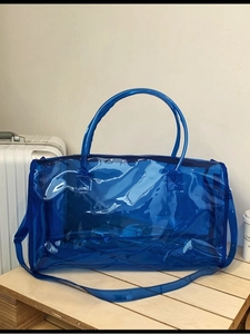 Blue transparent PVC waterproof beach bag with round handles and detachable shoulder strap