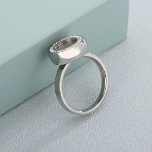 Elegant stainless steel ring featuring sparkling zircon pavé and hollow circular design