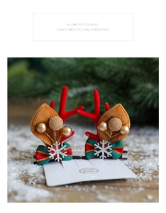 Detail of red antler hair clips with sequins, ribbons and soft brown velvet ears