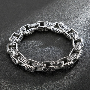 Retro titanium steel curb chain bracelet featuring intricate engraved floral patterns