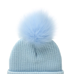 Close-up of light blue ribbed knit baby hat with a large fluffy pom-pom detail