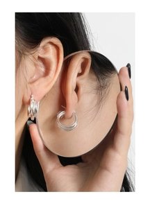 Detail of S925 sterling silver multi-layer hoop earrings shown in a creative mirror reflection