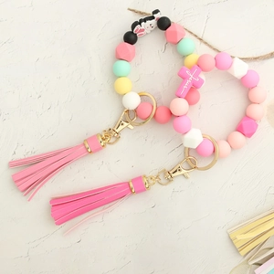 Pastel silicone bead keychain bracelet with pink tassel and cross charm with Jesus text