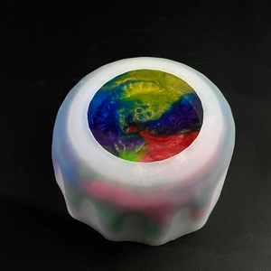 Detailed top view of 5-grid silicone mixing cup with vibrant multi-color resin pigments