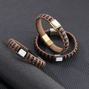 Detail of woven leather bracelets with magnetic clasps and square white stone inlay