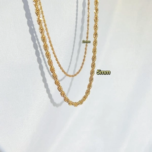 Detailed comparison of 2mm and 5mm golden rope chain necklaces with metallic finish