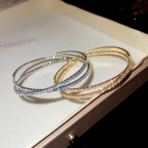Bracelet croisé de style français avec zircons en finitions dorée et argentée