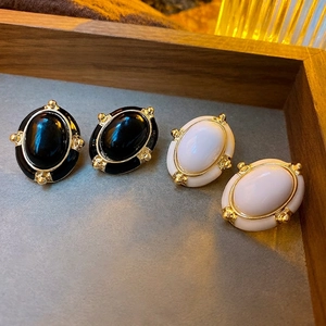 Vintage oval enamel stud earrings with gold trim in black and white styles