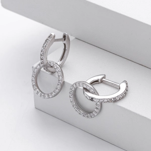Detailed macro view of S925 sterling silver interlocking double circle earrings with cubic zirconia