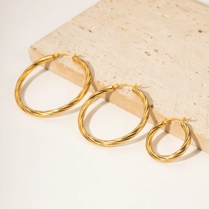 Golden stainless steel cable twisted hoop earrings set in three sizes for women