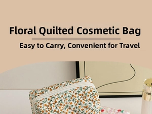 Macro detail of floral quilted makeup bag featuring soft fabric and white zipper closure