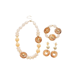 Irregular acrylic jewelry set with beige resin beads and gold accents on white background