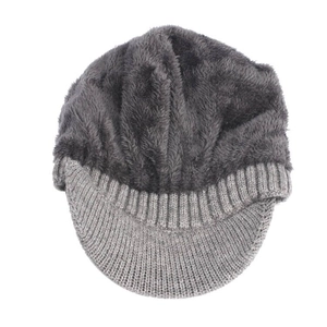 Detailed top view of a thick grey knit beanie with visor and warm plush lining texture