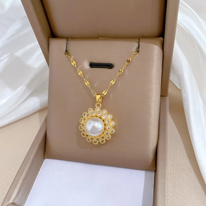 Elegant gold titanium necklace with bird nest pearl pendant and sparkling crystals