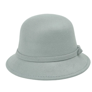 Detail of elegant wool felt pillbox hat with a decorative bow and fine stitching