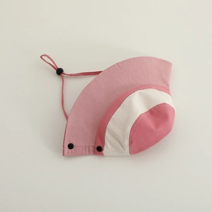Close-up of tricolor patchwork sun hat featuring adjustable windproof cord and snaps
