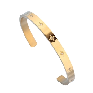 Gold stainless steel C-shaped open bangle featuring engraved stars and center zircon stones