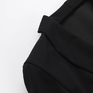 Vue macro détaillée de la texture du tissu noir de haute qualité pour robe blazer