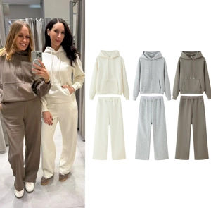 Close-up detail of hooded sweatshirt and wide-leg trousers set in multiple colors