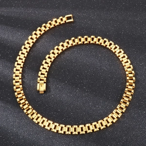 Detailed view of a 10mm golden stainless steel watch-style link necklace on black background