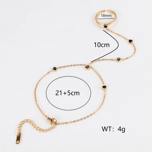 Golden heart ring bracelet combo with chain link design on plain white background
