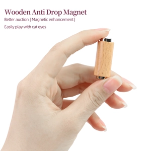 Macro detail of the wood grain handle and cylindrical magnetic head for cat eye nail art