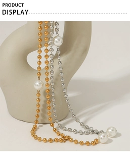 Modern Y-shaped beaded necklace in gold and silver with elegant pearl accents
