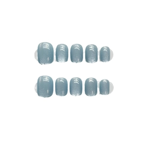Blue cat-eye press-on nails set in a short round shape with rainbow shimmer