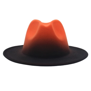 Close-up of orange to black gradient wool felt fedora with a classic flat brim design