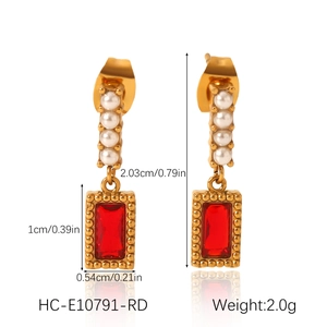 Detailed view of gold pearl stud with red zircon pendant and product dimensions